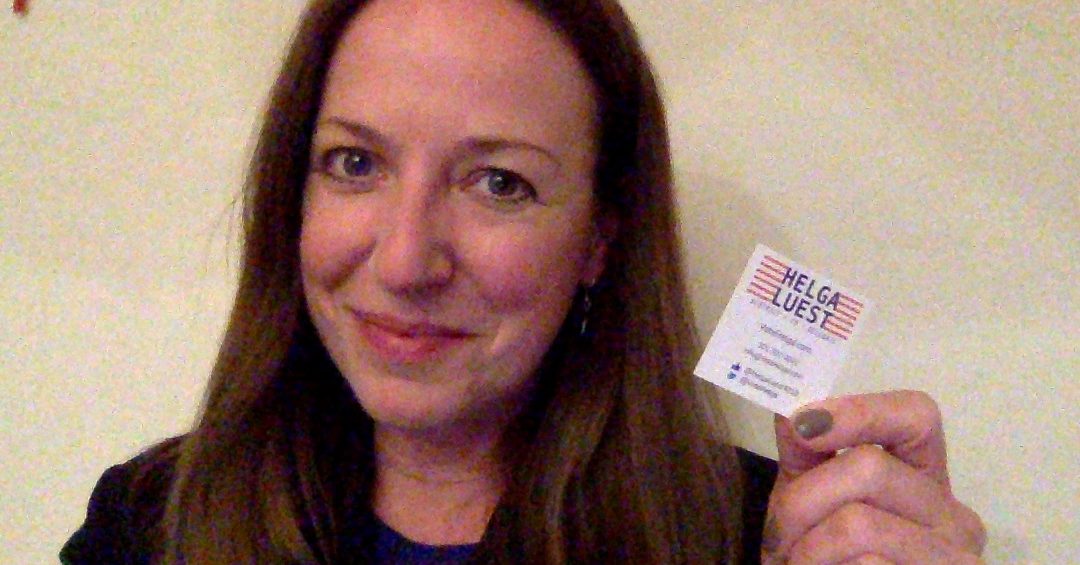 Helga Luest with 2x2 enviro-friendly business card - half the carbon footprint